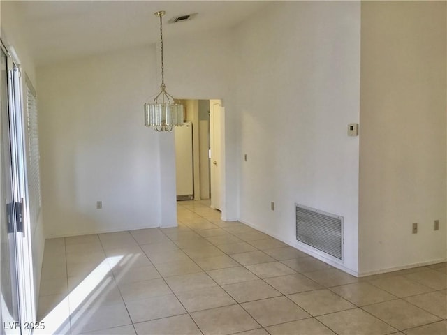 unfurnished room featuring an inviting chandelier, light tile patterned floors, visible vents, and lofted ceiling