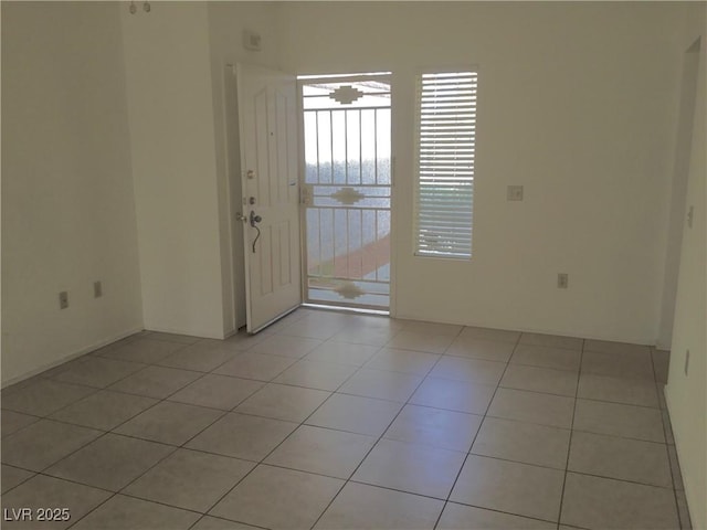 spare room featuring light tile patterned floors