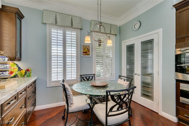 dining space with french doors, baseboards, dark wood-type flooring, and crown molding