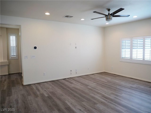 spare room with recessed lighting, wood finished floors, visible vents, and ceiling fan