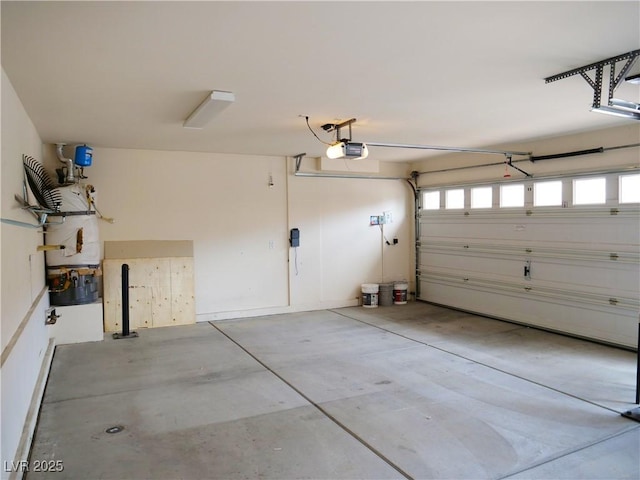 garage featuring a garage door opener and water heater