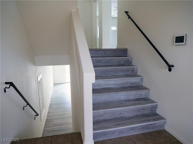 stairs with tile patterned flooring