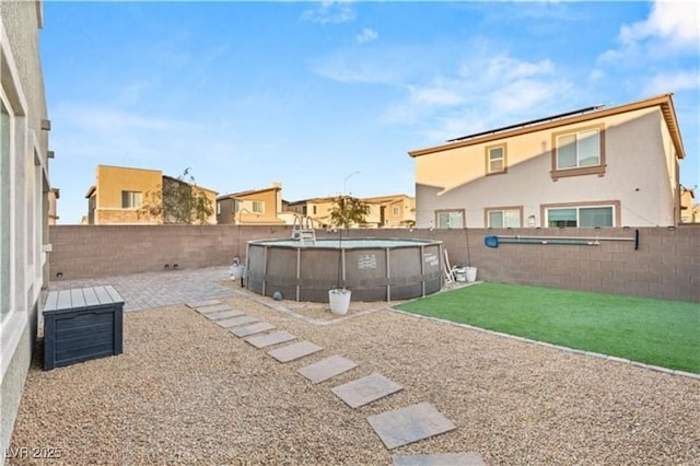 view of yard featuring a fenced in pool and a fenced backyard