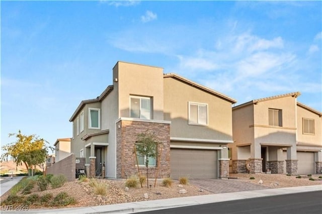 view of front facade with stone siding, stucco siding, driveway, and an attached garage