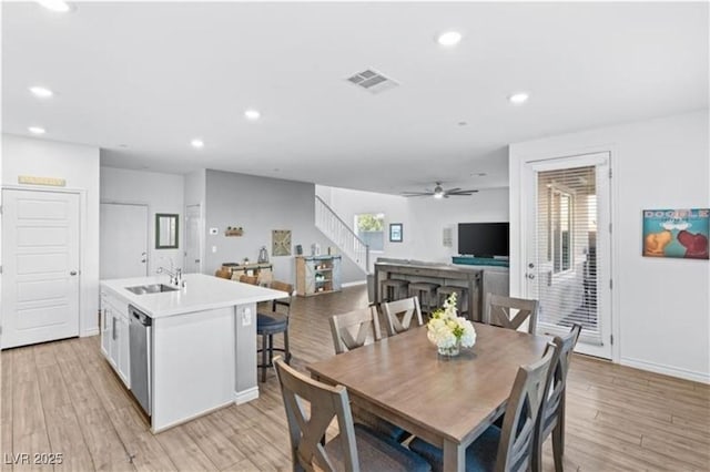 dining space featuring visible vents, stairs, recessed lighting, light wood-style floors, and a ceiling fan