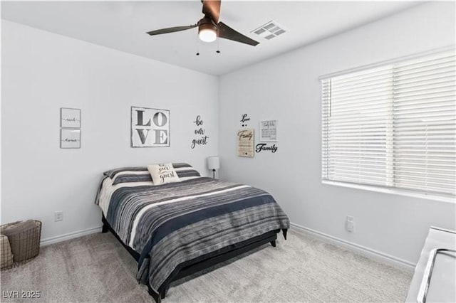 bedroom with visible vents, multiple windows, and carpet