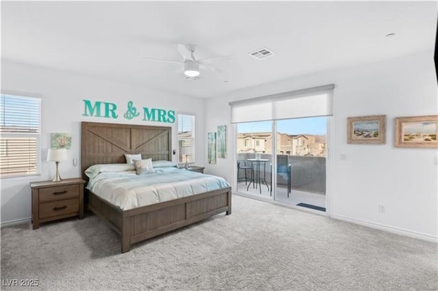 carpeted bedroom featuring access to exterior, visible vents, a ceiling fan, and baseboards