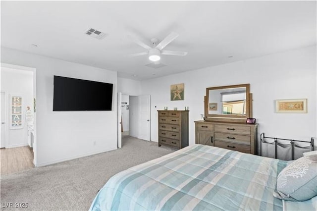 bedroom with visible vents, carpet flooring, and a ceiling fan