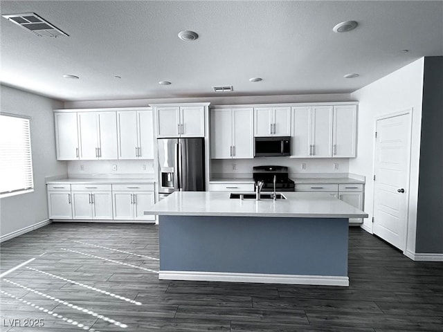 kitchen with visible vents, light countertops, baseboards, and appliances with stainless steel finishes