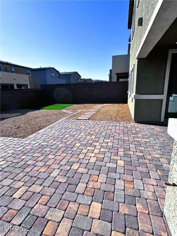 view of patio / terrace featuring fence