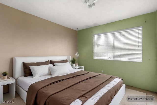 bedroom with light colored carpet