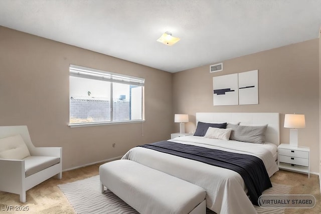 bedroom featuring visible vents and baseboards