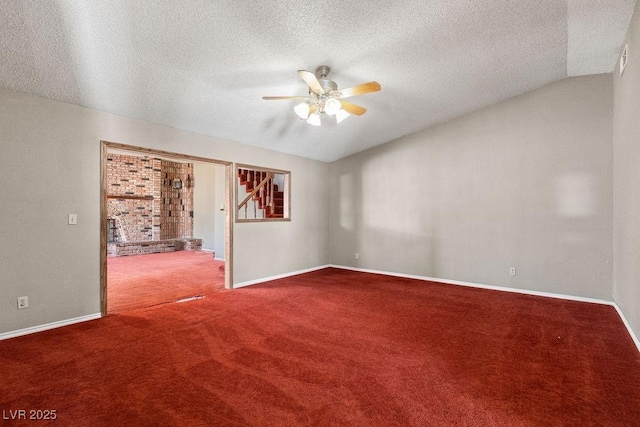 carpeted empty room featuring a textured ceiling, baseboards, and a ceiling fan