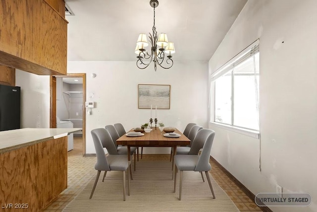 dining area featuring a chandelier