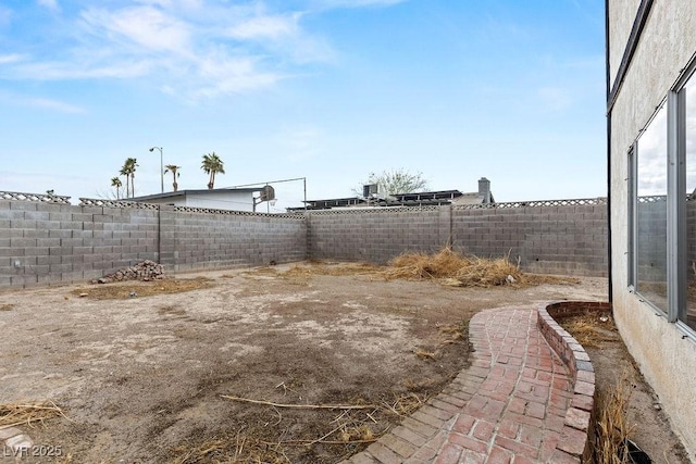 view of yard with a fenced backyard