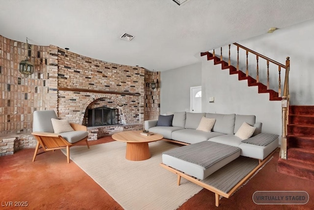 carpeted living area with stairs, a fireplace, visible vents, and a textured ceiling