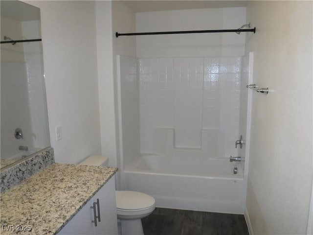 full bath featuring toilet, shower / tub combination, vanity, and wood finished floors