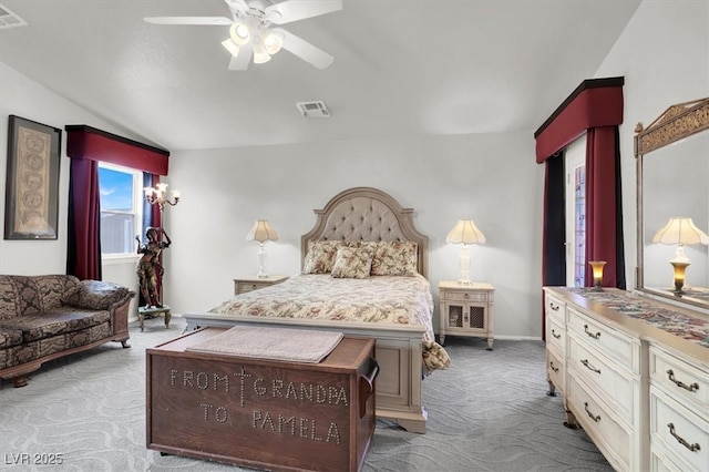 carpeted bedroom with visible vents, baseboards, ceiling fan, and vaulted ceiling