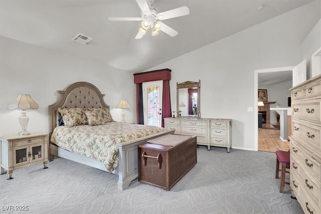 bedroom featuring baseboards, visible vents, carpet floors, ceiling fan, and vaulted ceiling