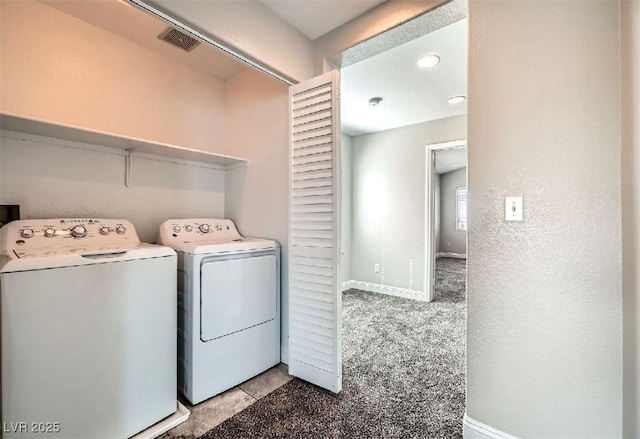 laundry room with baseboards, visible vents, washing machine and clothes dryer, laundry area, and carpet flooring