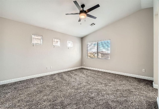 unfurnished room with lofted ceiling, visible vents, carpet floors, and ceiling fan