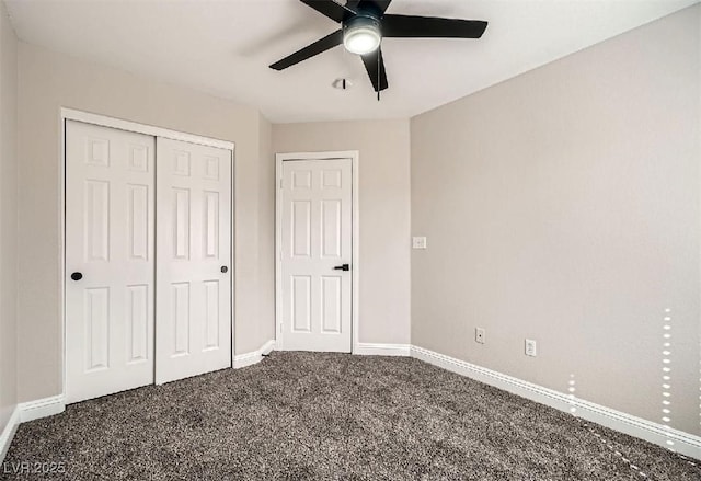 unfurnished bedroom featuring baseboards, carpet floors, a closet, and a ceiling fan