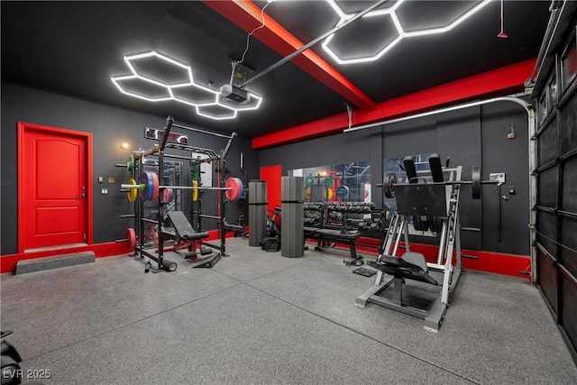 exercise room with a garage