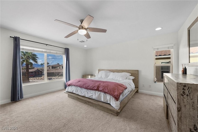 bedroom featuring light carpet, recessed lighting, baseboards, and ceiling fan