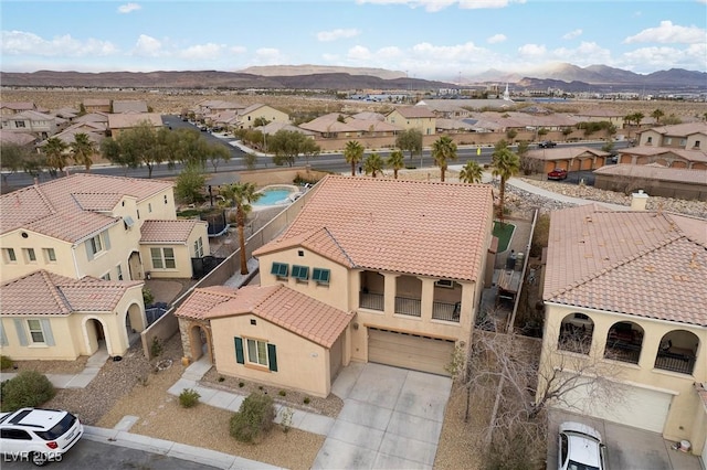 bird's eye view featuring a residential view and a mountain view