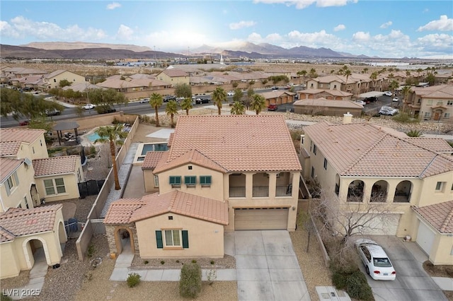 aerial view with a mountain view and a residential view