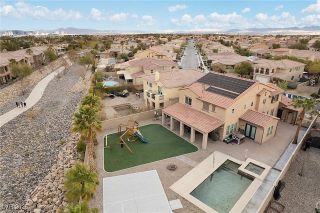 birds eye view of property featuring a residential view and a mountain view