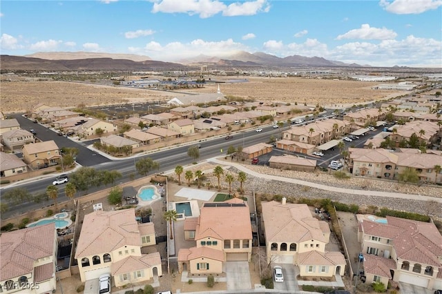 bird's eye view with a residential view and a mountain view