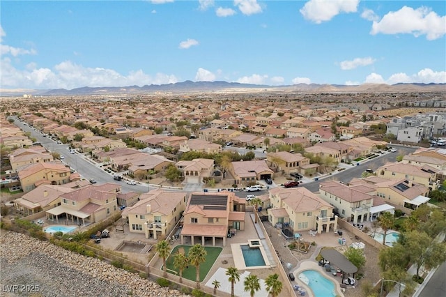 aerial view featuring a mountain view and a residential view