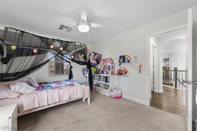 bedroom featuring visible vents, carpet flooring, a ceiling fan, and baseboards