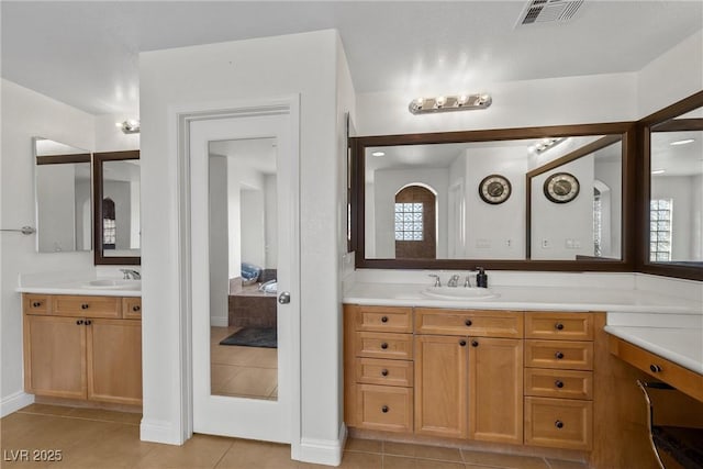 full bath featuring tile patterned flooring, vanity, and visible vents