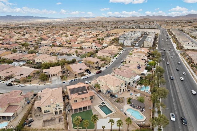 drone / aerial view with a mountain view and a residential view