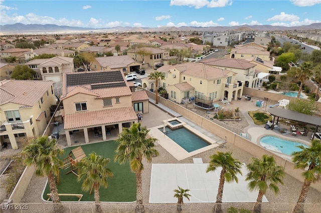 aerial view with a mountain view and a residential view