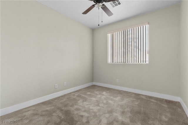 spare room with visible vents, baseboards, carpet, and a ceiling fan