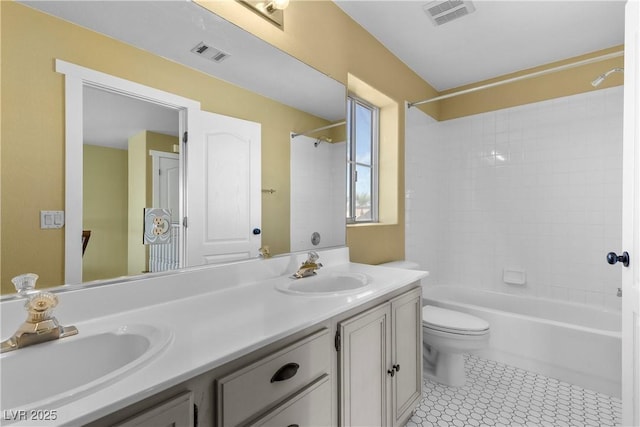 full bath featuring a sink, visible vents, and double vanity