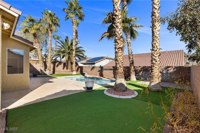 view of yard with a patio area, a fenced backyard, and a fenced in pool