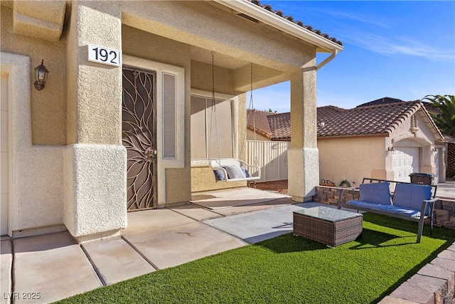 view of patio / terrace featuring an outdoor living space and fence