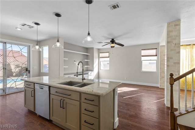 kitchen featuring dishwasher, dark wood-type flooring, visible vents, and a sink