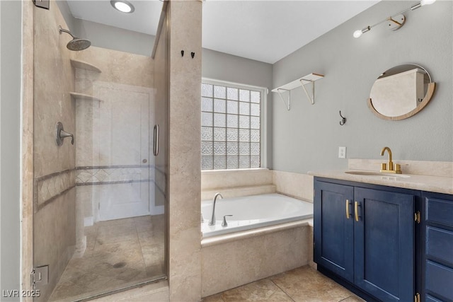 full bathroom featuring tile patterned floors, a stall shower, vanity, and a bath