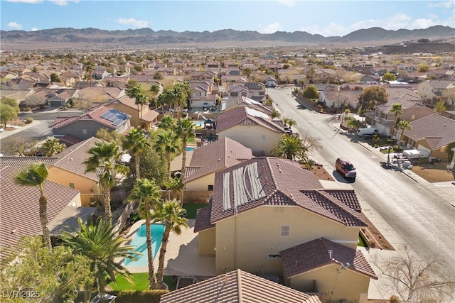 drone / aerial view with a residential view and a mountain view