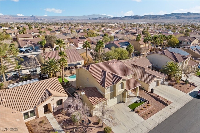 birds eye view of property featuring a residential view and a mountain view