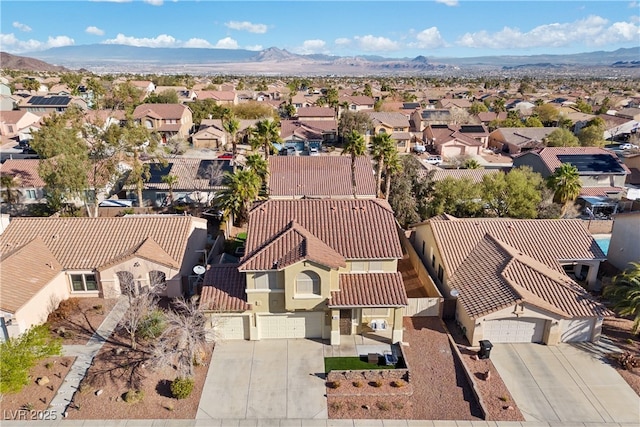 drone / aerial view with a mountain view and a residential view