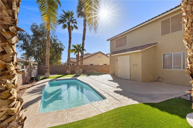 view of swimming pool with a patio, a fenced backyard, and a fenced in pool