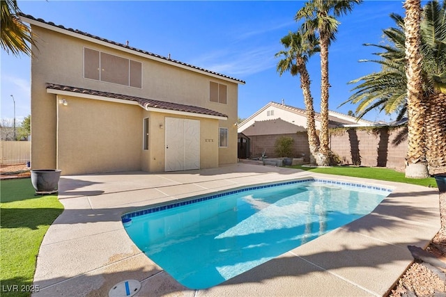 view of swimming pool with a fenced in pool, a patio, and fence