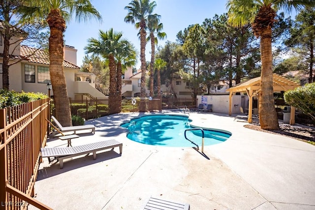 pool featuring a patio area, a pergola, and fence