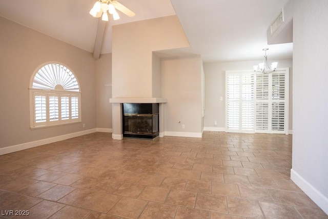 unfurnished living room featuring a glass covered fireplace, lofted ceiling, ceiling fan with notable chandelier, and baseboards